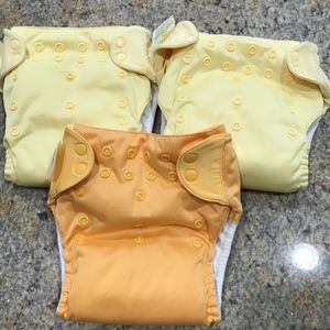 3 Bum Genius Swim Pants 2 Yellow and 1 Orange